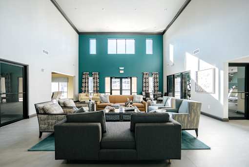 A living room with a grey sofa and a coffee table.