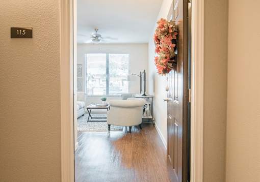 A bathroom with a tub and a window.