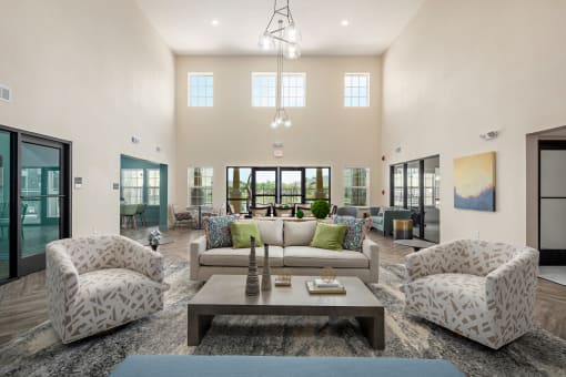 a living room with couches and chairs and a coffee table
