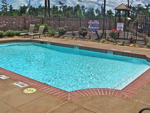 a swimming pool with a fence around it