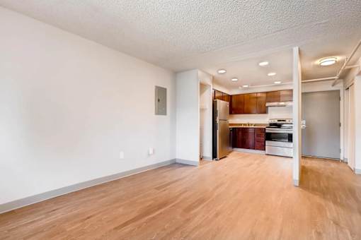 A room with wooden floors and white walls.