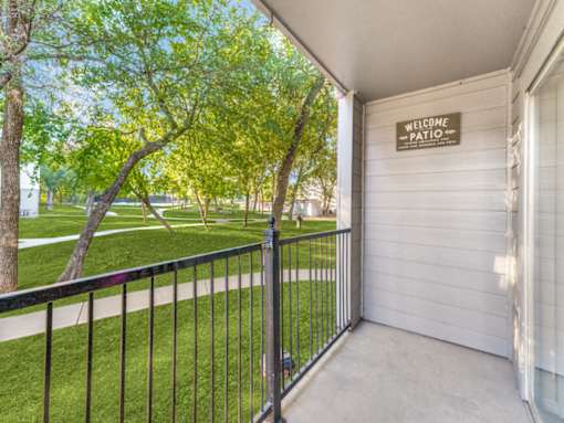 A patio area with a sign that says "Welcome Patio".