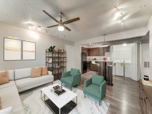 an open living room and kitchen with a ceiling fan  at Vibe on Riverside, Austin, TX, 78741