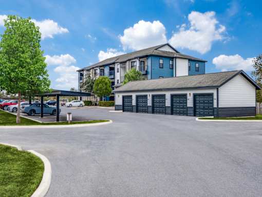 A large building with a parking lot in front of it.