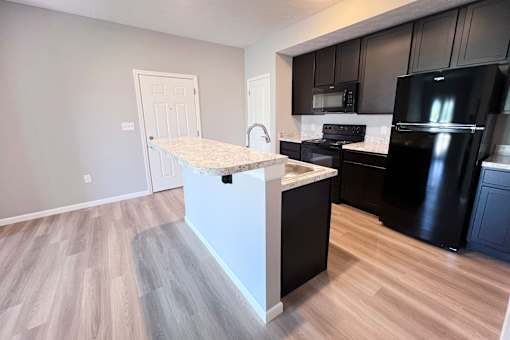 Kitchen with White Island at Hebron Station Apartments, Hebron, KY, 41048