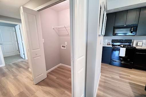 Kitchen Area and a Laundry Closet at Hebron Station Apartments, Hebron, Kentucky
