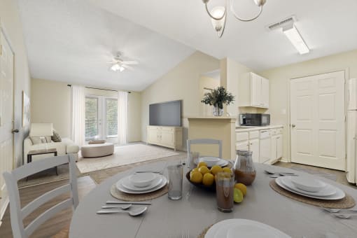 a living room and dining room with a table and chairs at Baldwin Farms Apartments, Robertsdale