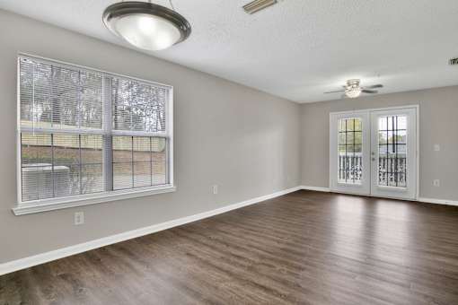 A room with a window and a door.