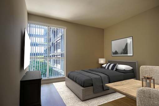 a bedroom with a bed and a large window