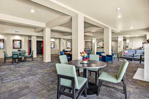 A large room with tables and chairs.