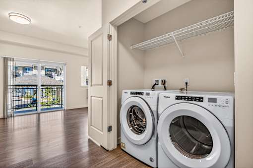 A laundry room with a washer and dryer.