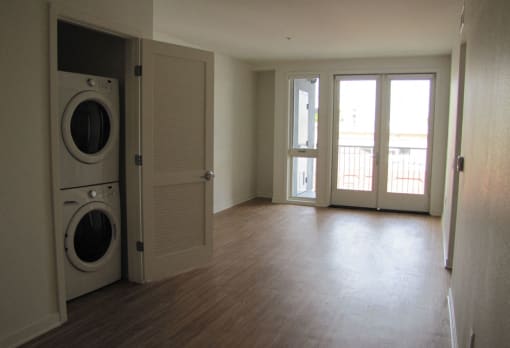 Mayfair Residences spacious living area with washer and dryer