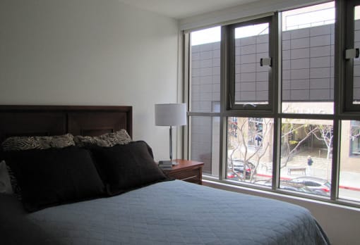 Mayfair Residences double bed and window