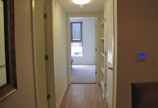 Mayfair Residences apartment hallway with shelves