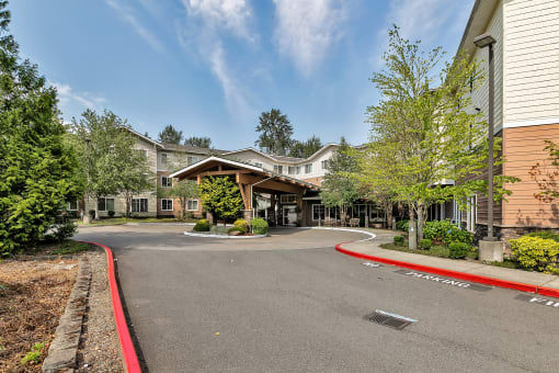 the view of a building with a curved road in front of it
