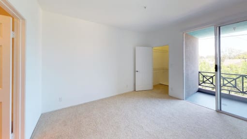 5015 Clinton Apartments unfurnished bedroom with sliding doors to patio