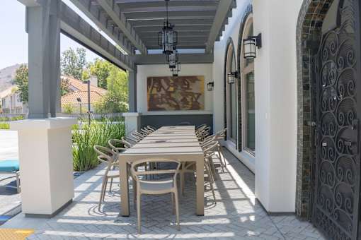 Horizons at Calabasas long outdoor dining table with chairs.