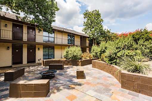 LaVita on Lovers Lane exterior building, outdoor fire pit, and patio seating area