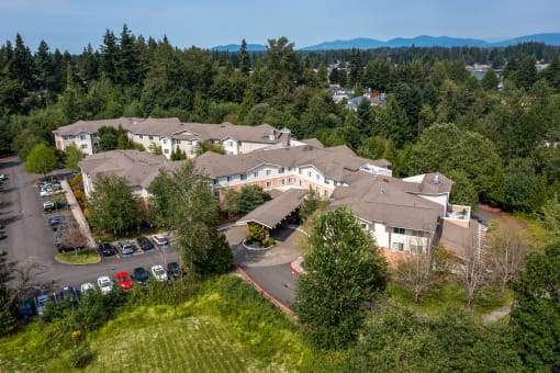 a aerial view of a large building surrounded by trees