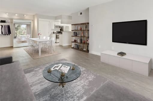 a living room with a table and a television