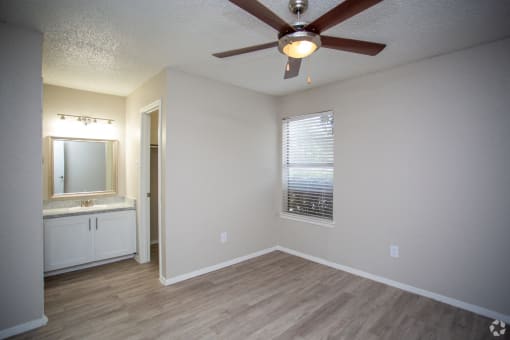 Bedford Oaks Apartments bedroom with sink and mirror