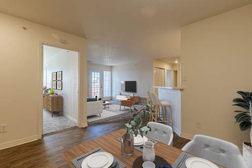 A dining room with a table set for two.