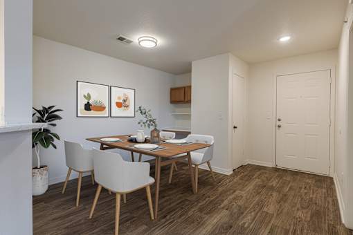 A dining room with a wooden table and chairs.