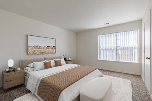 A bedroom with a large bed and a painting on the wall.