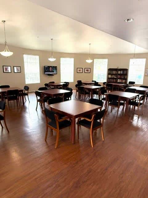 Sorrento Villas clubhouse with tables and chairs.