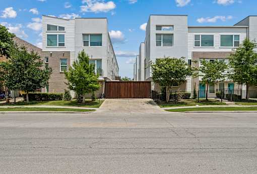 A modern residential area with a gated entrance.