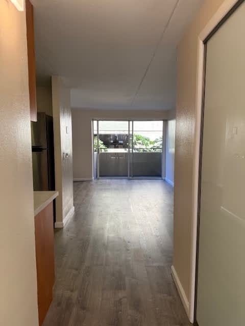 Napili Towers entryway hallway with a white door on the right.