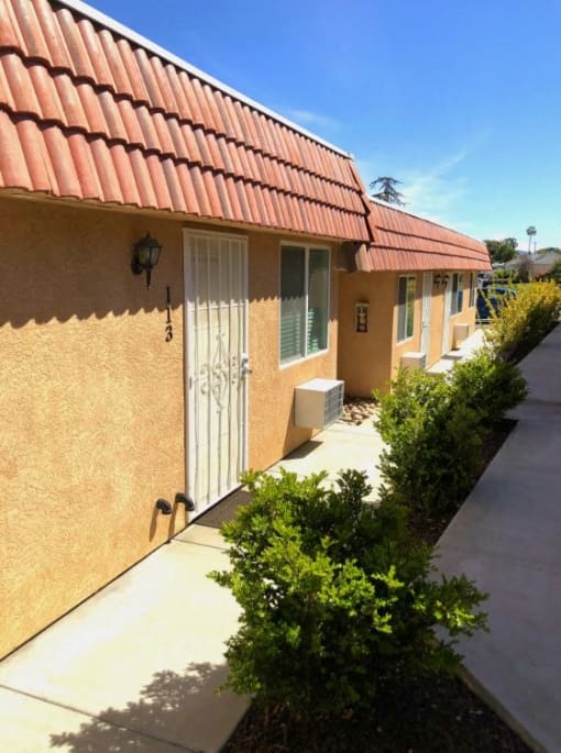 Limoncello Apartments exterior building and pathway