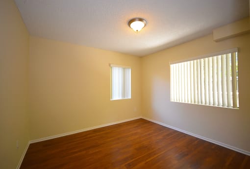 Monarch Terrace unfurnished bedroom with two windows