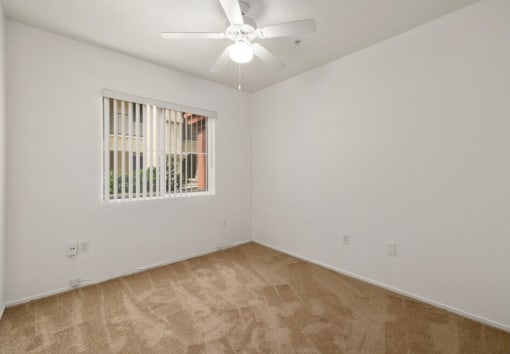La Entrada four bedroom unit bedroom with ceiling fan