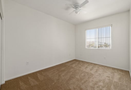 La Entrada three bedroom unit bedroom with ceiling fan