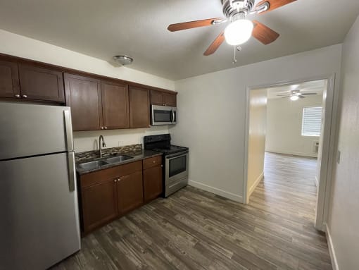 a kitchen and living room in an apartment