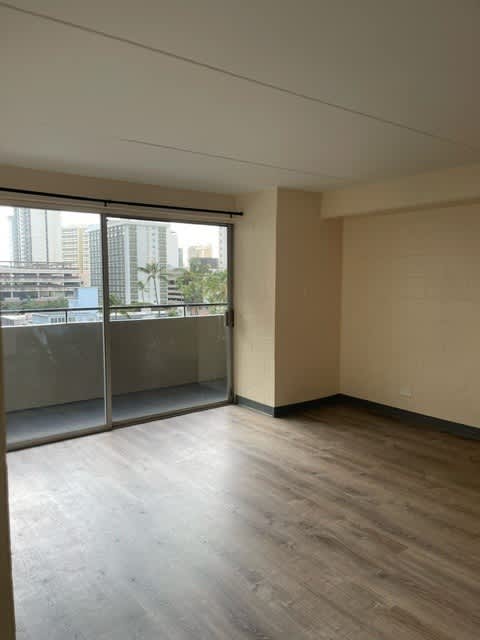Napili Towers living room with a view of the city through the windows.