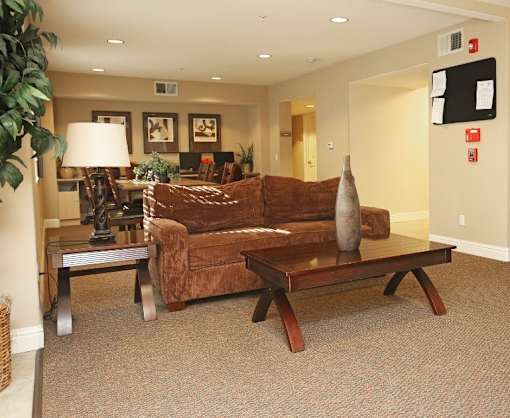 a living room with a couch and a table