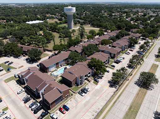 A bird's eye view of a residential area with a sign that reads "Leesburg".