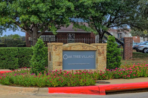 Oak Tree Village Apartments Exterior Front of Building and Sign