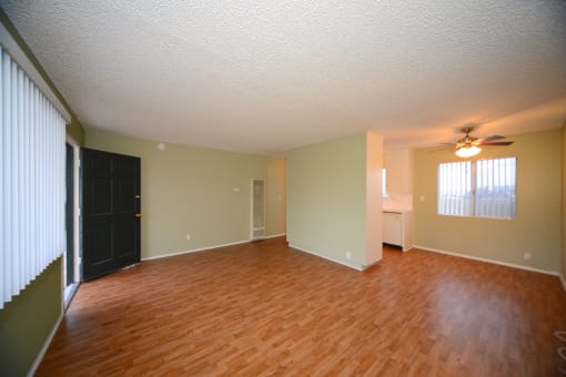 Ocean View Townhomes unfurnished living space with wooden floors full view