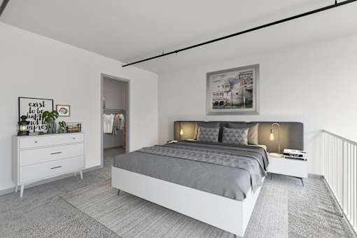 A bedroom with a large bed, a nightstand, and a dresser.