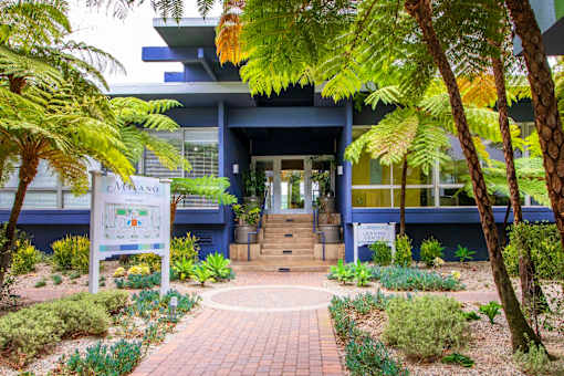A building with a sign that says "ORANGO" in front of it.