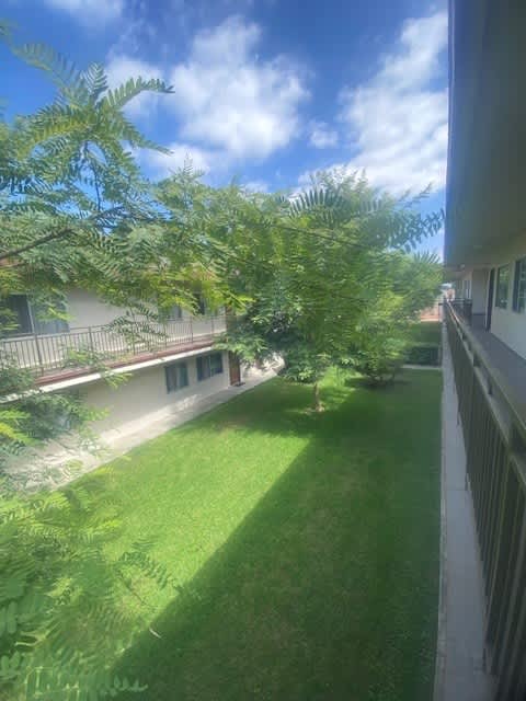 a view of a yard from a balcony