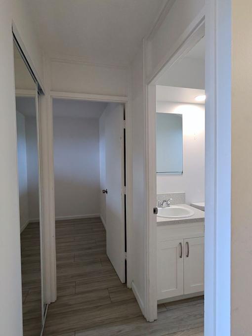 A bathroom with a sink and a mirror.