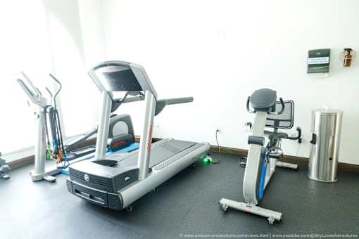 Horizons at Calabasas gym with treadmill with a tablet on top and other exercise equipment.