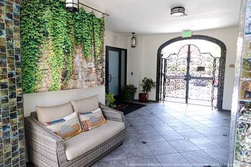 Horizons at Calabasas entrance with a couch, a plant, and a door.