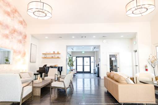 Horizons at Calabasas lobby with a piano and a couch.