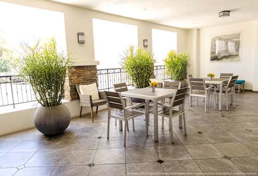 Horizons at Calabasas community patio with a table and chairs.