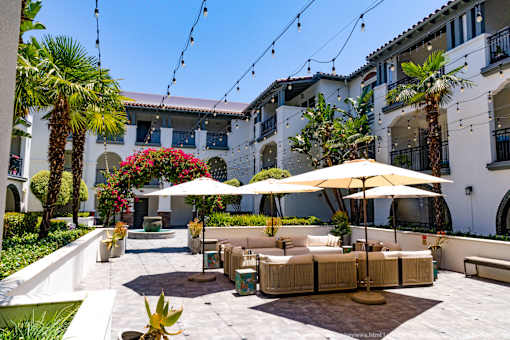 Horizons at Calabasas courtyard with a white umbrella and a white couch.